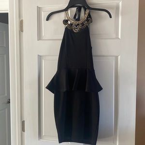Little black dress with gold hardware. Size: small